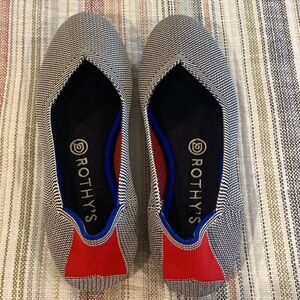 Rothy's Black and White Flats with Red Accents